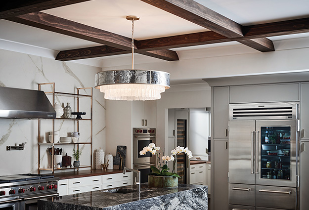 A metal and crystal chandelier in a kitchen