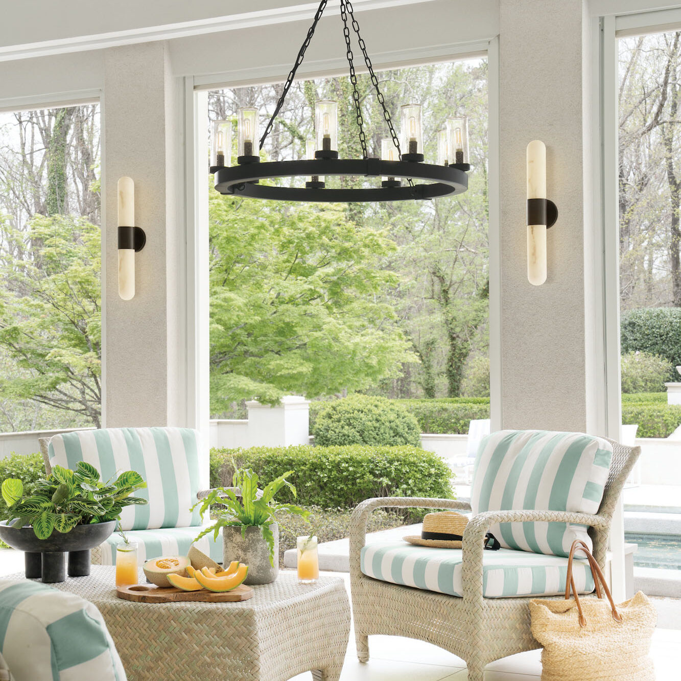 Light and airy living space focused on bright windows overlooking a manicured green lawn.
